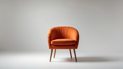 Obraz premium A stylish orange armchair with a round shape and tufted upholstery, positioned against a minimalistic white background