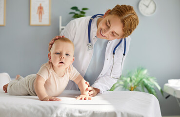 Pediatrician doctor examines little child patient in a hospital, focusing on essential healthcare...