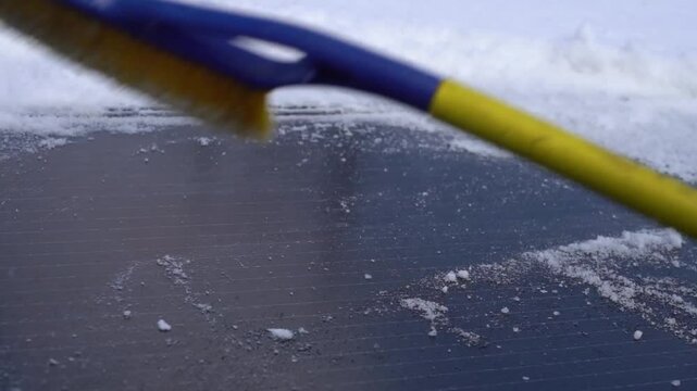 Removing snow from solar panels in winter