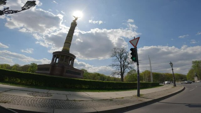 Driving on a roundabout with a view of the Victory Column in Berlin, Germany.