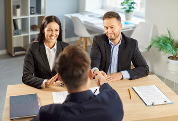 Happy office handshake, real estate agent meeting together, excited husband and wife shake hand, visiting broker or banker thanking for help, successful project, customer thanking, tenancy agreement