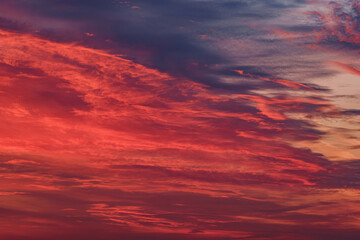 Sunset shimmers. Scarlet clouds