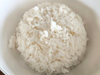 Cooked rice in ceramic bowl. Food menu concept