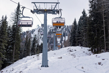 Happy family with kids in winter ski resort, skiing winter time