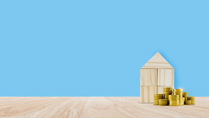 Model house and coin stack, planning savings money to buy home concept, saving concept, Property investment real estate and house mortgage financial concept.