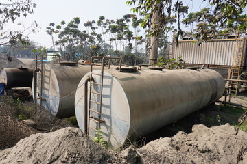 The 20,000-liter stainless steel horizontal storage tank which are commonly used for storing liquids like diesel, chemicals, or water with nature background
