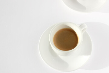 Freshly Brewed Espresso Shot on White Table. Coffee Drinking.	