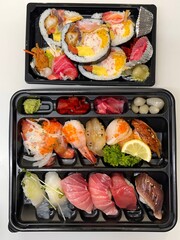An assortment of fresh sushi, beautifully arranged with vibrant ingredients like raw fish, rice, and seaweed. This elegant Japanese dish offers a perfect balance of flavor and presentation.