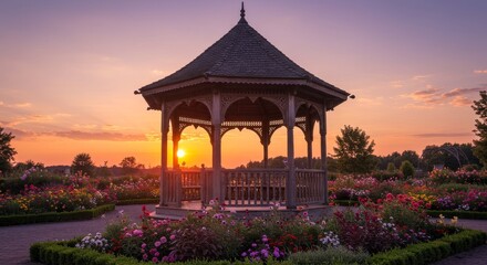 Fototapeta premium Sunset Serenity Gazebo Garden - Peaceful sunset view, gazebo in vibrant flower garden, tranquility, romance, nature's beauty