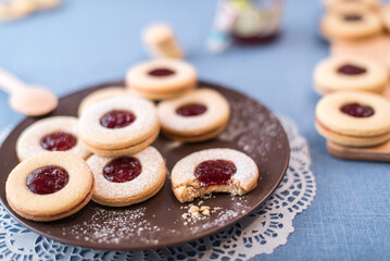Round shortbread cookies with jam lie on the table