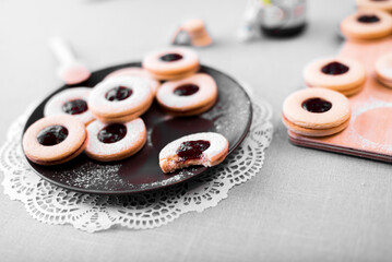 Round shortbread cookies with jam lie on the table