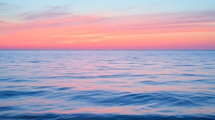 Serene Pink Sunset Over Calm Ocean Waters