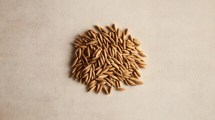 Fototapeta premium A small pile of cumin seeds arranged in a row on a neutral, textured background, their shape and earthy tones clearly visible.