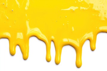 Yellow paint drips down a white background