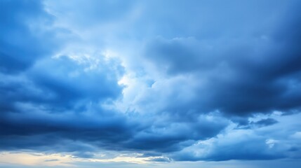 Fototapeta premium A beautiful view of a blue sky filled with dramatic clouds during sunset.