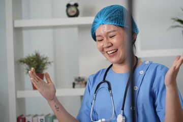 Asian nurse working in private room .