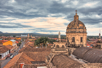 Fototapeta premium Granada, Nicaragua Dome. Cloudy cityscape with colonial architecture.