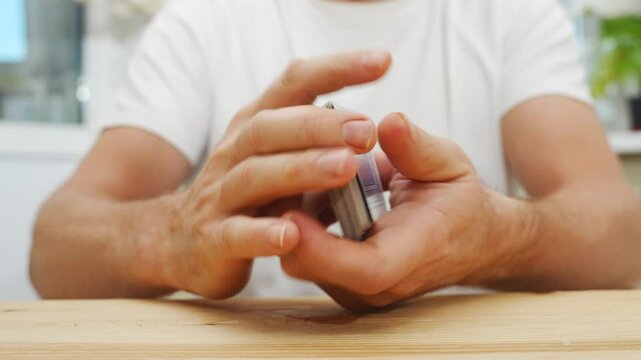 male hands shuffle a deck of playing cards. gambling. A board game for spending leisure time with friends and family.