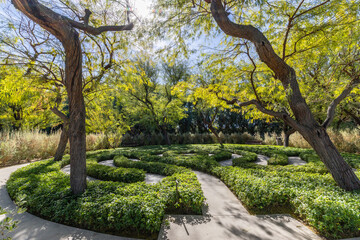 A beautiful labyrinth garden offers warmth and reflection in a vibrant outdoor setting