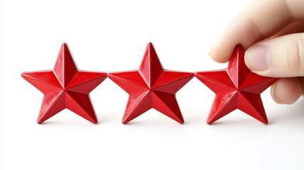 A hand placing three red stars on a clean white background, symbolizing excellent service