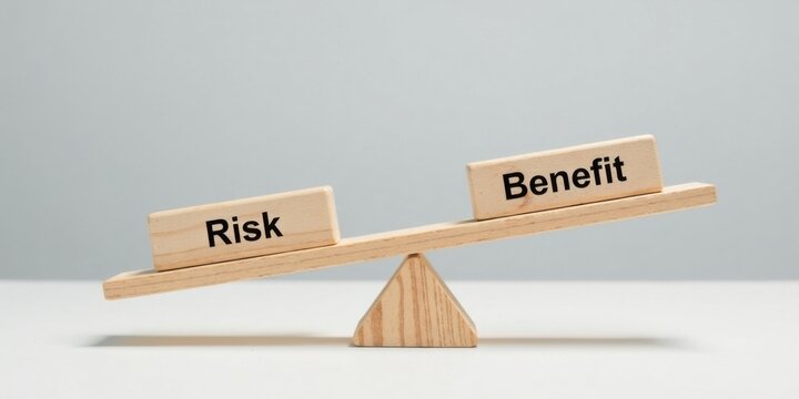 Wooden blocks on a seesaw illustrate the delicate balance between risk and benefit, a concept crucial for strategic decision-making.