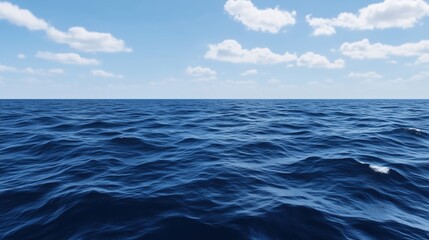 Obraz premium A serene view of calm ocean waves with a clear blue sky and fluffy clouds.