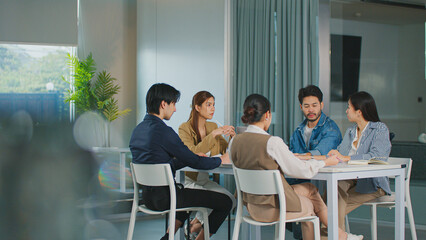 Business people discussing finance strategy in a teamwork meeting for successful startup development, analysing marketing and accounting plans in a corporate office collaboration. Women in Leadership