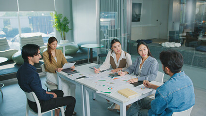 Confident Women leader discussing strategy meeting teamwork collaboration business growth analysis financial data presenting reports managing startup success corporate office people partnership