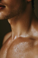 Naklejka premium Water droplets on man’s clavicle in shower