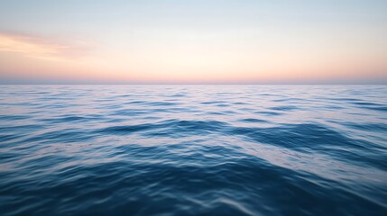 Obraz premium Serene Ocean Waves Under a Pastel Sunset Sky
