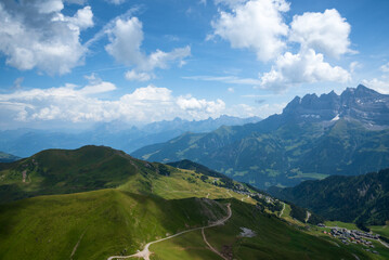 Fototapeta premium View of French Alps with village houses near border with Switzerland in Haute-Savoie, France. View from Pointe des Mossettes (Swiss side). Beautiful mountain landscape background