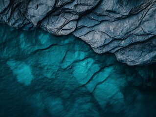 Aerial View of Rocky Coastline with Clear Turquoise Water and Underwater Rock Formations