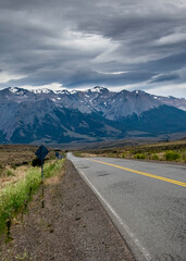 Naklejka premium Highway crossing patagonian forest landscape, rio negro, argentina