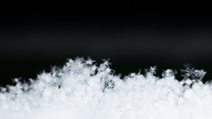 winter photo of snowflakes in the snow