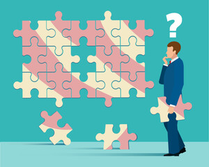 Businessman tries to put together puzzle