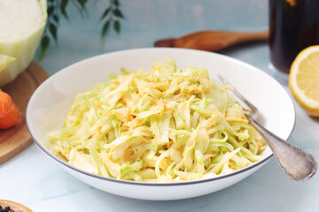 A bowl with coleslow salad
