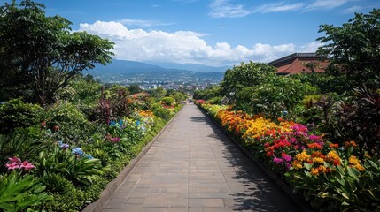 Naklejka premium Vibrant Flower Garden Path Leading to Mountain View