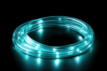 Fiber optic cables. Glowing blue LED light strip coiled on a dark surface, creating a vibrant ambience.