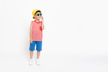 Asian little boy in red striped shirt summer outfits with yellow hat standing and open mouths...