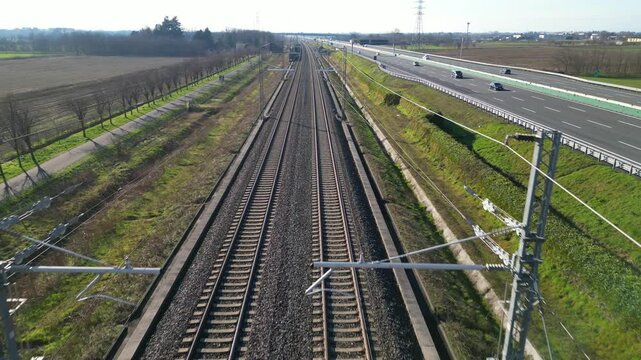 Europe, Italy , Milan - Frecciarossa  Hight speed 300km h train railway from Milan  to Turin  view from the drone - the faster way to travel in Italy for tourist and passengers - tourist destination 