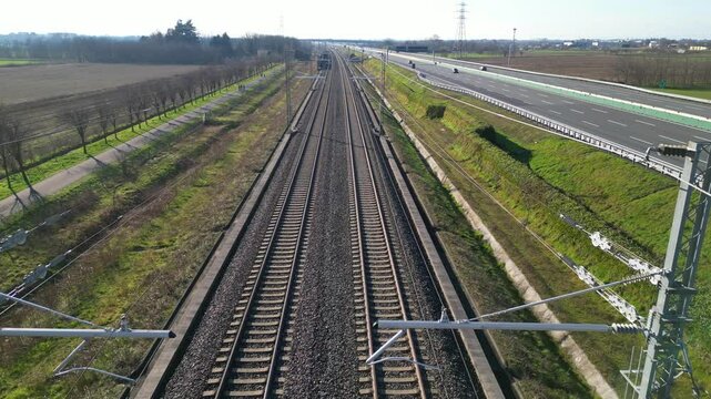 Europe, Italy , Milan - Frecciarossa  Hight speed 300km h train railway from Milan  to Turin  view from the drone - the faster way to travel in Italy for tourist and passengers - tourist destination 