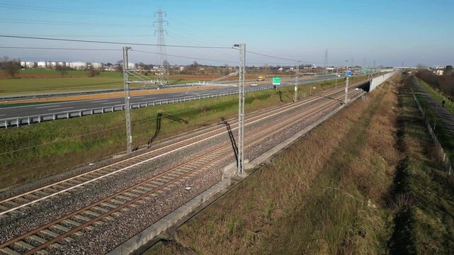 Europe, Italy , Milan - Frecciarossa  Hight speed 300km h train railway from Milan  to Turin  view from the drone - the faster way to travel in Italy for tourist and passengers - tourist destination 