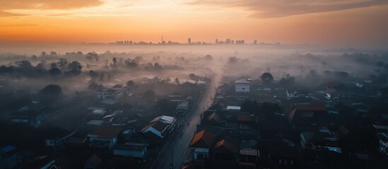 Aerial Cityscape View Revealing Sunrise Over Misty Urban Landscape