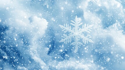 Beautiful snowflake falling gently against soft cloudy blue background