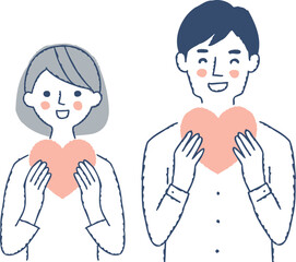  ハートを持っている笑顔の若いカップル