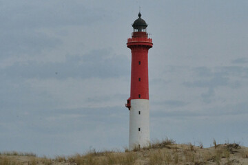 lighthouse on the coast of france with sand