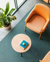 Mid-Century Modern Therapy Space Cozy Orange Chair and Round Wooden Table with Therapeutic Book in Bright Office - Enhancing Family Counseling and Interactive Communication