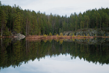 Fototapeta premium Reflection on a lake in Finish forest