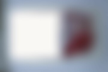 Abstract blurry pink-gray background with a white spot. Background for lettering, notebook cover, laptop screen.