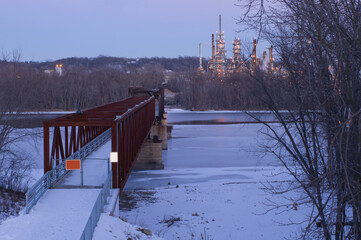 rock island swing bridge from inver grove heights to saint paul park and oil refinery across mississippi river in minnesota